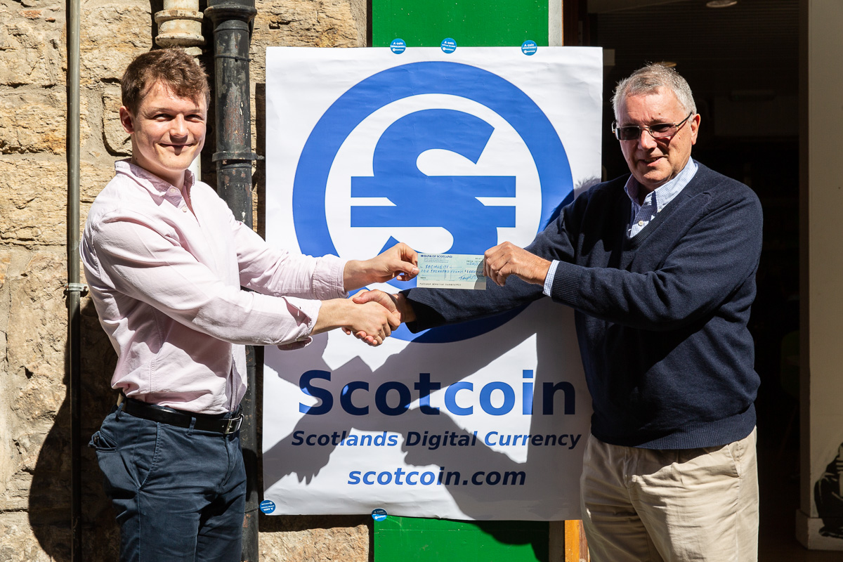 Scotcoin presents Social Bite with a cheque for Â£1k.